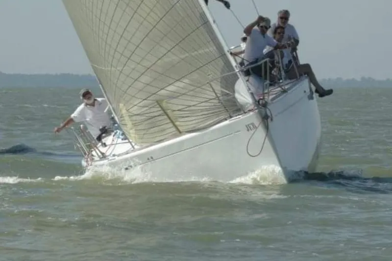 Slide: The Image of Sailing Beneteau First 40.7 yacht, 2001 model, on open water with crew. - 30