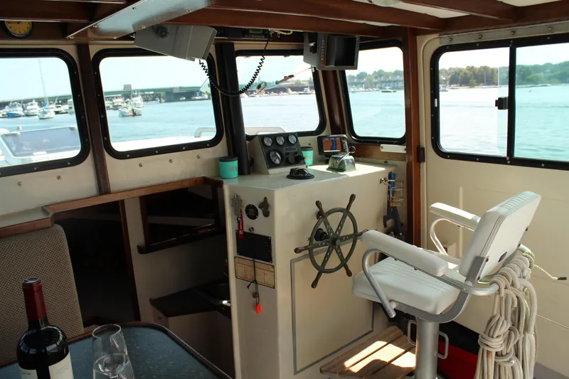 Slide: The Image of Interior of 1992 Novi 32 Downeast boat with helm, windows, and nautical equipment. - 20
