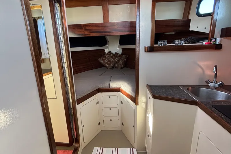 Slide: The Image of Interior of 1982 Stanley Greenwood/Novi 32 Downeast boat with cozy cabin and kitchenette. - 25