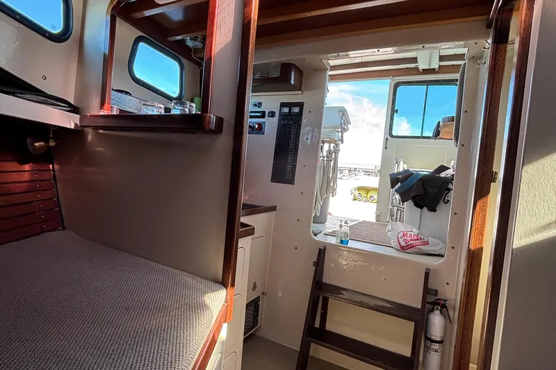 Slide: The Image of Interior of 1982 Stanley Greenwood/Novi 32 Downeast boat, featuring cabin and deck access. - 26