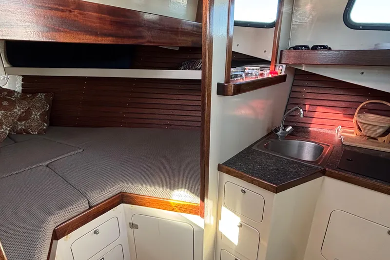 Slide: The Image of Cozy 1982 Stanley Greenwood/Novi 32 Downeast boat interior with bed and kitchenette. - 27