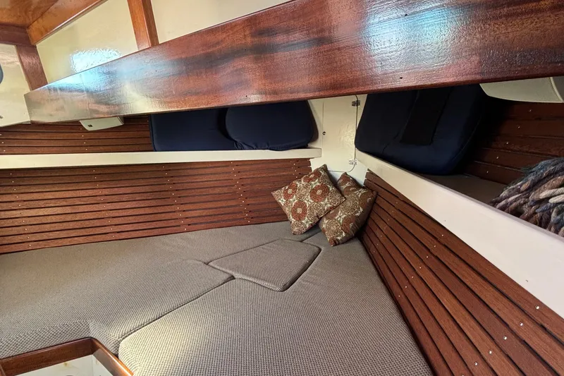 Slide: The Image of Cozy interior of 1982 Stanley Greenwood/Novi 32 Downeast boat with cushions and wood paneling. - 29