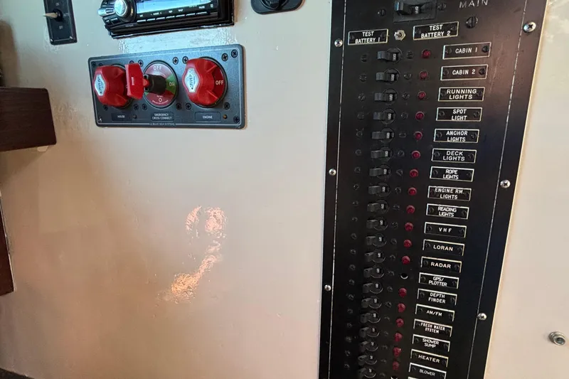 Slide: The Image of Control panel of a 1982 Stanley Greenwood/Novi 32 Downeast boat, featuring switches and dials. - 39