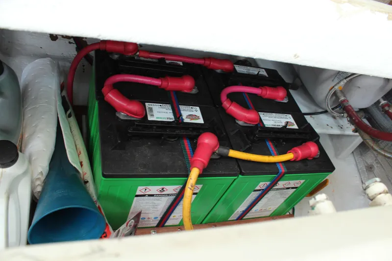 Slide: The Image of Battery compartment of 1992 Novi 32 Downeast boat with connected cables. - 42