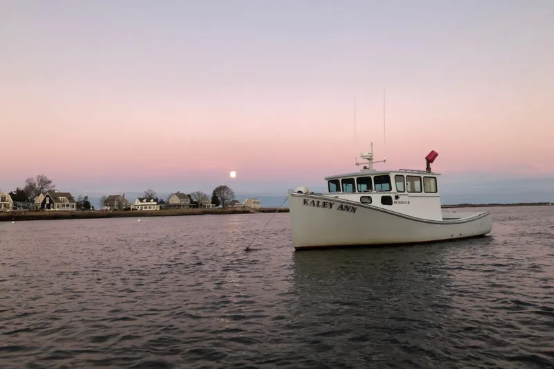 Slide: The Image of 1982 Stanley Greenwood/Novi 32 Downeast boat "Kaley Ann" on calm water at sunset. - 5