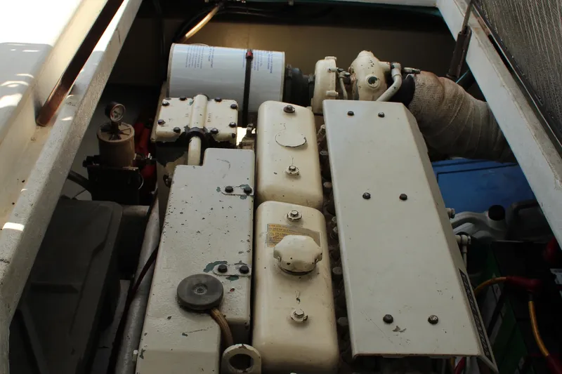 Slide: The Image of Engine compartment of a 1992 Novi 32 Downeast boat, showcasing mechanical components. - 57