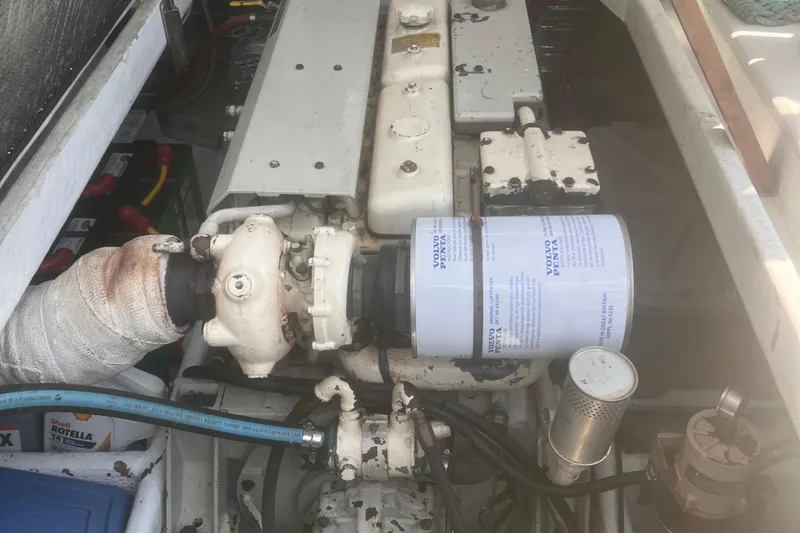 Slide: The Image of Engine compartment of a 1992 Novi 32 Downeast boat, featuring a Volvo Penta filter. - 59