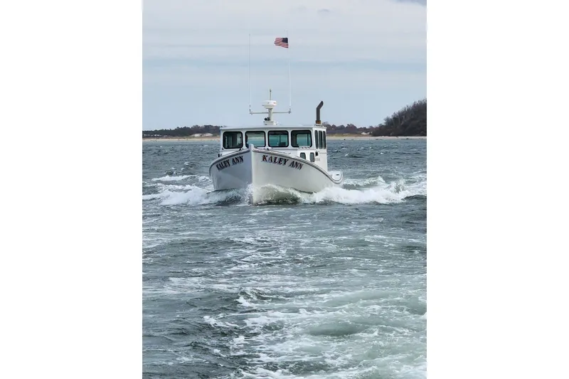 Slide: The Image of 1982 Stanley Greenwood/Novi 32 Downeast boat "Kaley Ann" navigating choppy waters. - 6