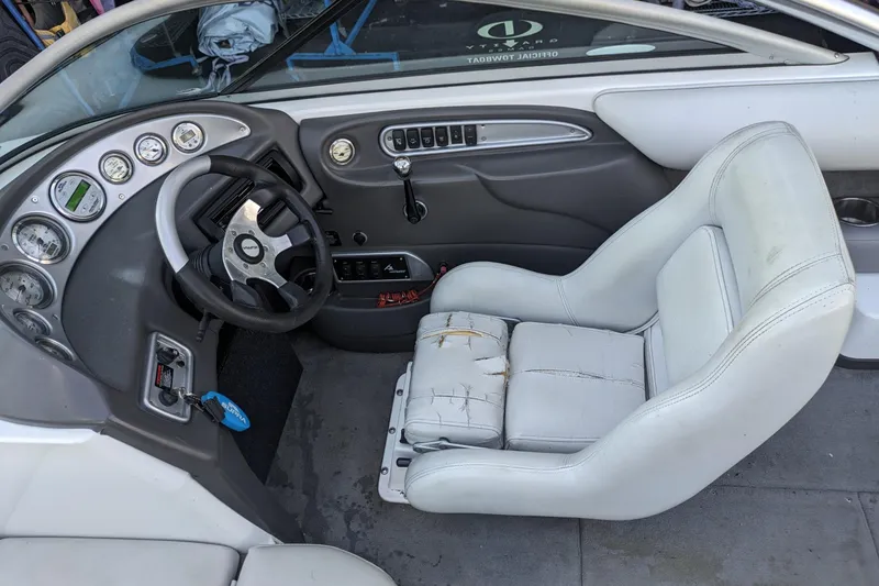 Slide: The Image of 2005 Supra Launch 21 V boat interior with steering wheel and gauges. - 19