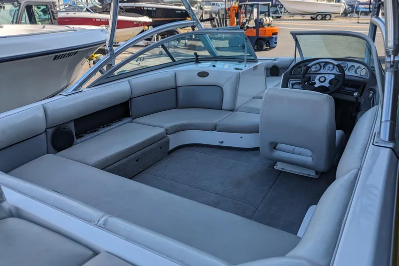 Slide: The Image of 2005 Supra Launch 21 V boat interior with spacious seating and modern dashboard. - 25