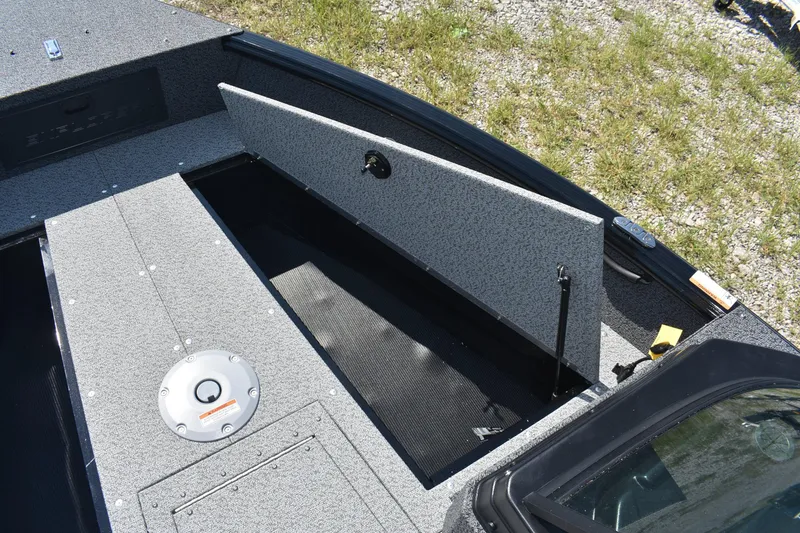 Slide: The Image of 2026 Lund 1800 Explorer Sport boat with open storage compartment on deck. - 15