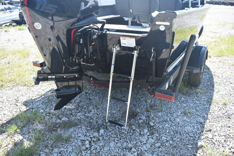 Slide: The Image of 2026 Lund 1800 Explorer Sport boat rear view with motor and ladder. - 6