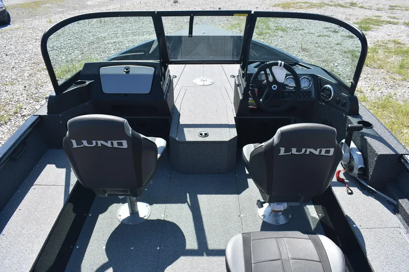 Slide: The Image of 2026 Lund 1800 Explorer Sport boat interior with dual seats and steering console. - 7