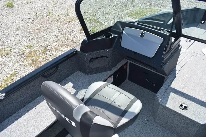 Slide: The Image of Interior of 2026 Lund 1800 Explorer Sport boat with seating and dashboard. - 8