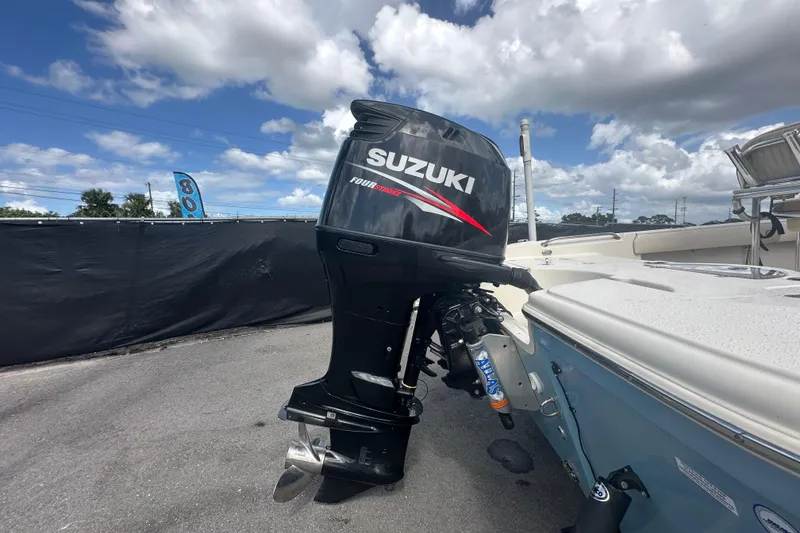 Slide: The Image of 2014 Sea Chaser 210 LX Bay Runner boat with Suzuki 175 engine, parked outdoors. - 3