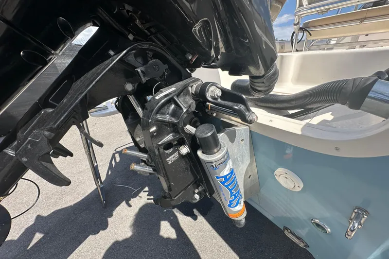 Slide: The Image of 2014 Sea Chaser 210 LX Bay Runner boat parked near a wooden fence. - 4