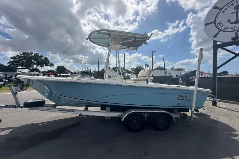 Slide: The Image of 2014 Sea Chaser 210 LX Bay Runner boat console with steering wheel and controls. - 7