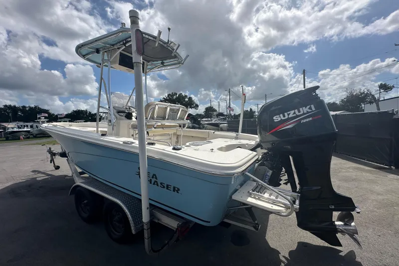 Slide: The Image of 2014 Sea Chaser 210 LX Bay Runner boat console with steering wheel and seating. - 9