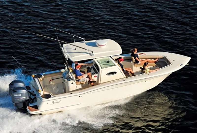 The Image of Manufacturer Provided Image: 2013 Scout 275 LXF boat cruising on water with passengers. - 1