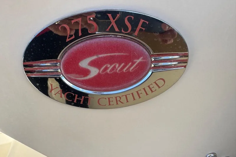 Slide: The Image of Scout 275 LXF 2013 yacht certified emblem with red and chrome design. - 18