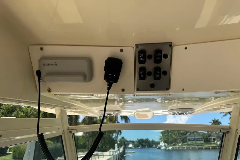 Slide: The Image of 2013 Scout 275 LXF boat interior with Garmin device and control panel. - 29