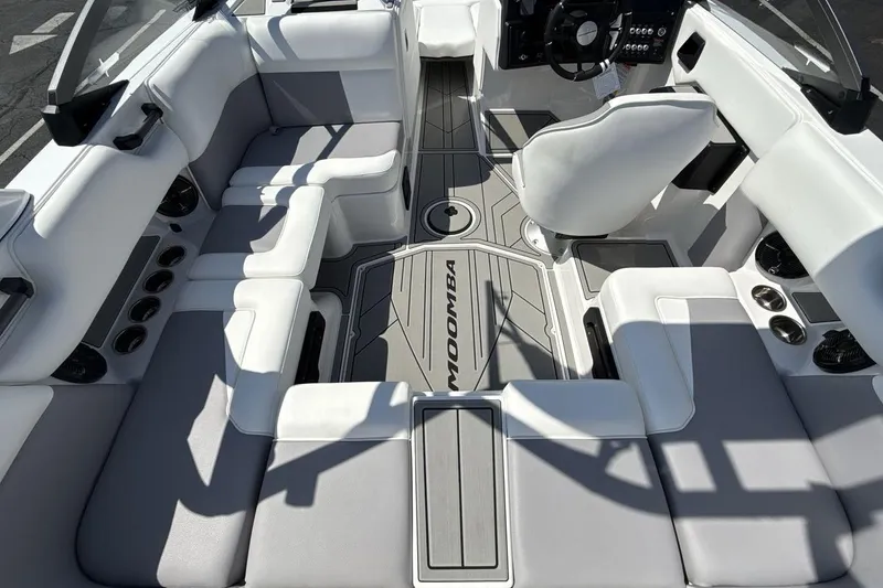 Slide: The Image of 2026 Moomba Mondo boat interior with sleek seating and modern dashboard design. - 10