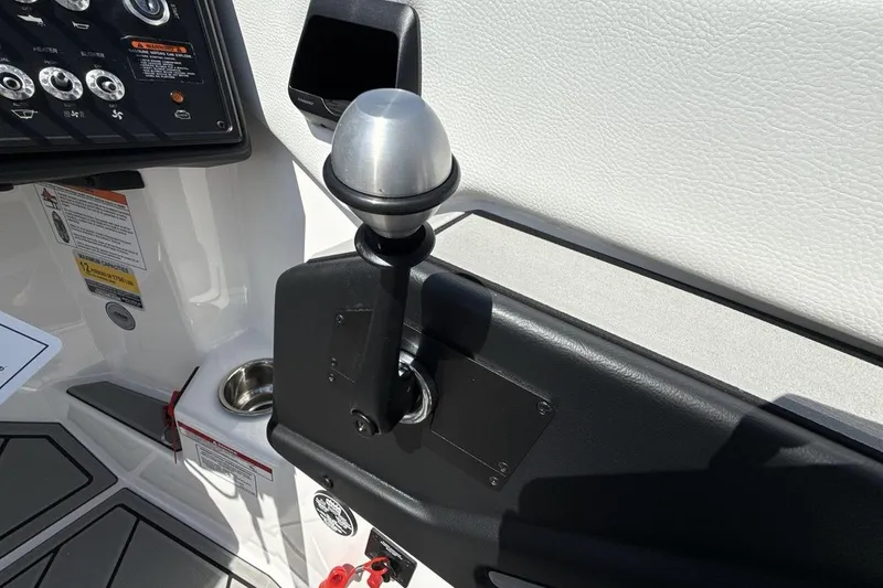 Slide: The Image of 2026 Moomba Mondo boat control panel with throttle lever and dashboard controls. - 16