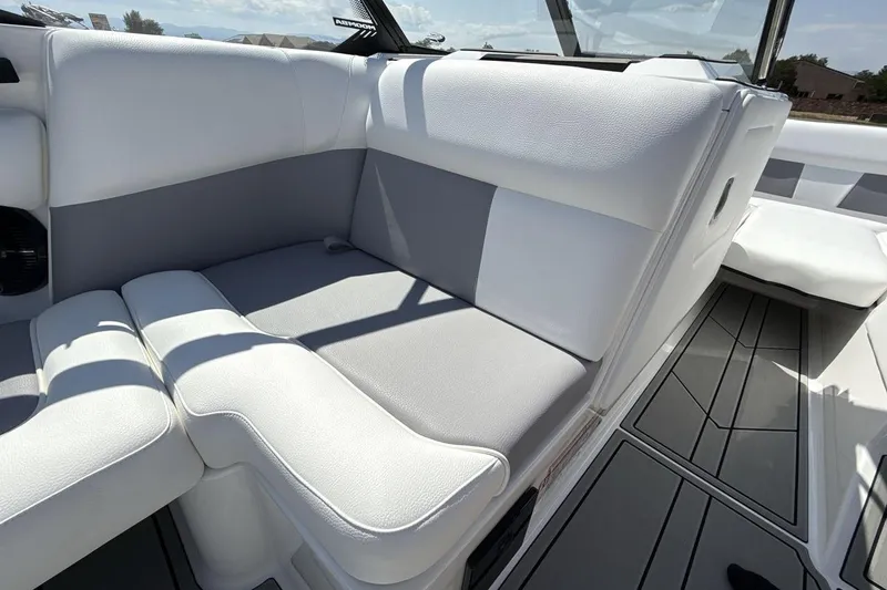 Slide: The Image of 2026 Moomba Mondo boat interior with white and gray seating, sleek design. - 17