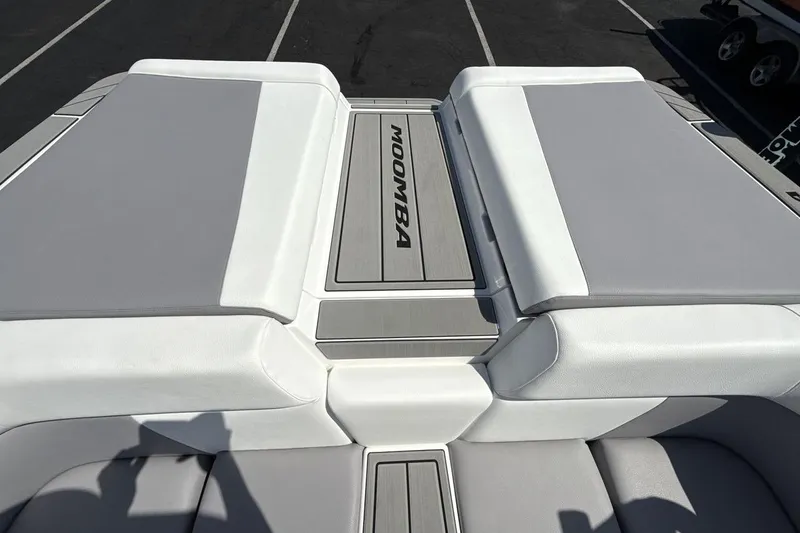 Slide: The Image of 2026 Moomba Mondo boat interior with gray and white seating. - 19