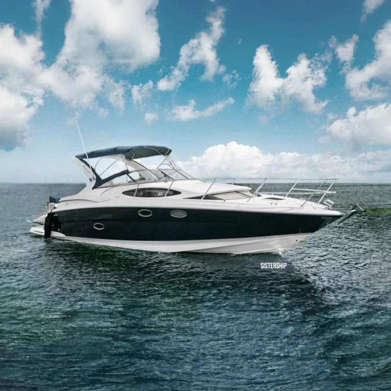 The Image of 2008 Regal 3360 Window Express yacht on calm ocean waters under a blue sky. - 0