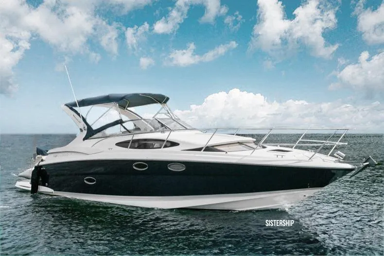 Slide: The Image of 2008 Regal 3360 Window Express boat on open water under a blue sky. - 1