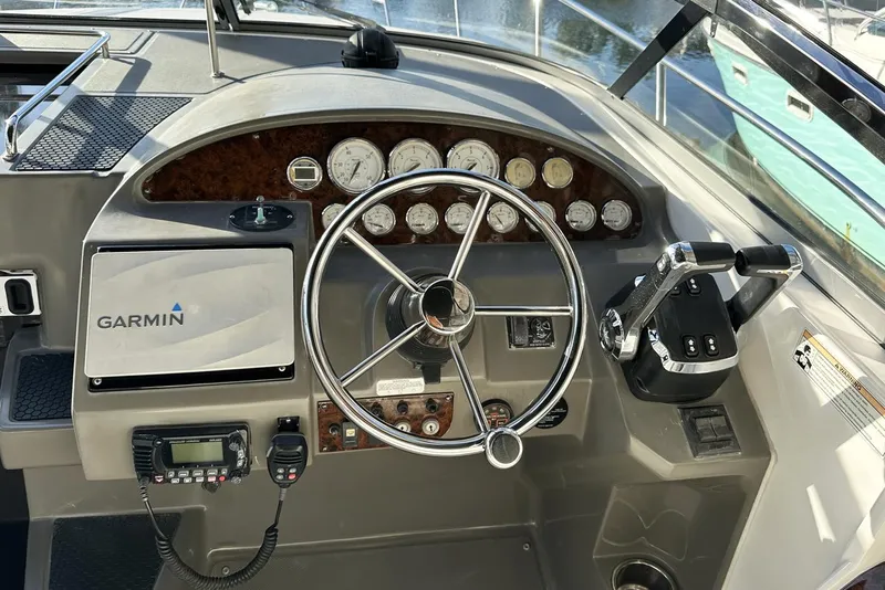 Slide: The Image of Helm of 2008 Regal 3360 Window Express with Garmin navigation and control instruments. - 14