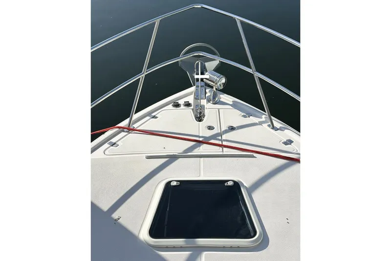Slide: The Image of 2008 Regal 3360 Window Express boat bow with railing and hatch. - 4