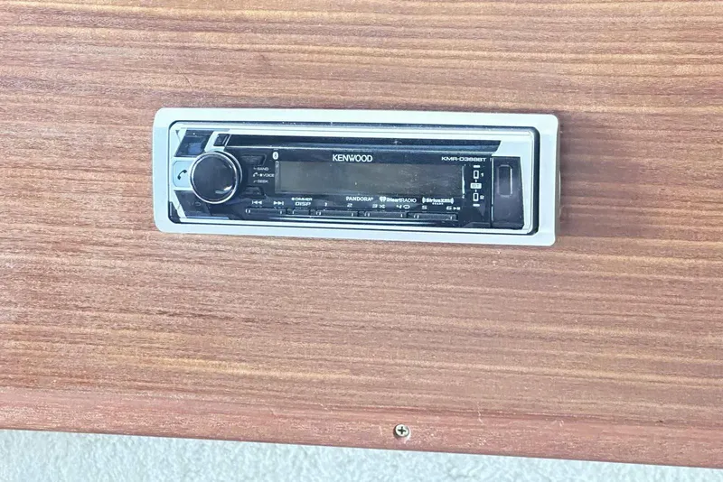 Slide: The Image of Kenwood stereo system on 1987 Sea Ray 340 Sundancer wooden panel. - 24