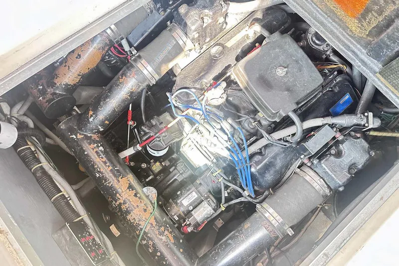 Slide: The Image of Engine compartment of a 1987 Sea Ray 340 Sundancer boat, showing mechanical components. - 30