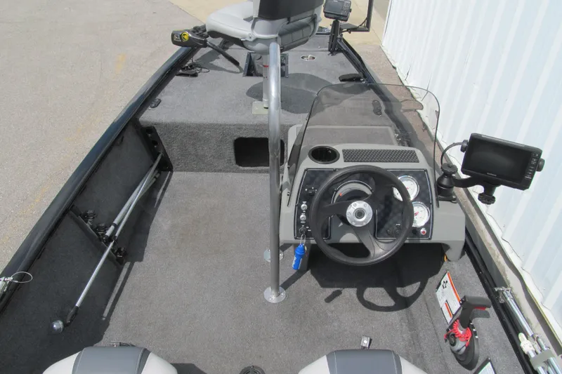 Slide: The Image of 2018 Tracker Pro 160 boat interior with steering wheel and navigation equipment. - 5