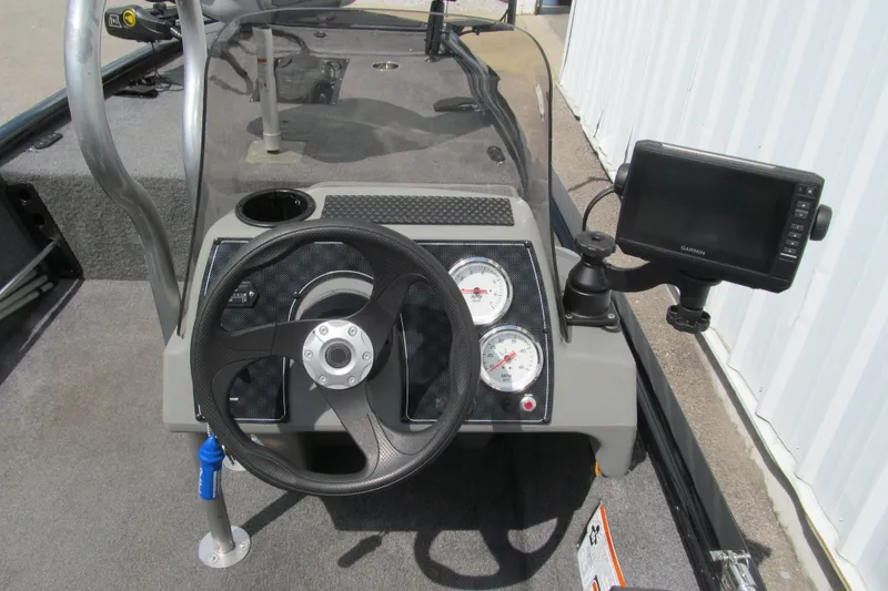 Slide: The Image of 2018 Tracker Pro 160 boat dashboard with steering wheel and Garmin GPS. - 6