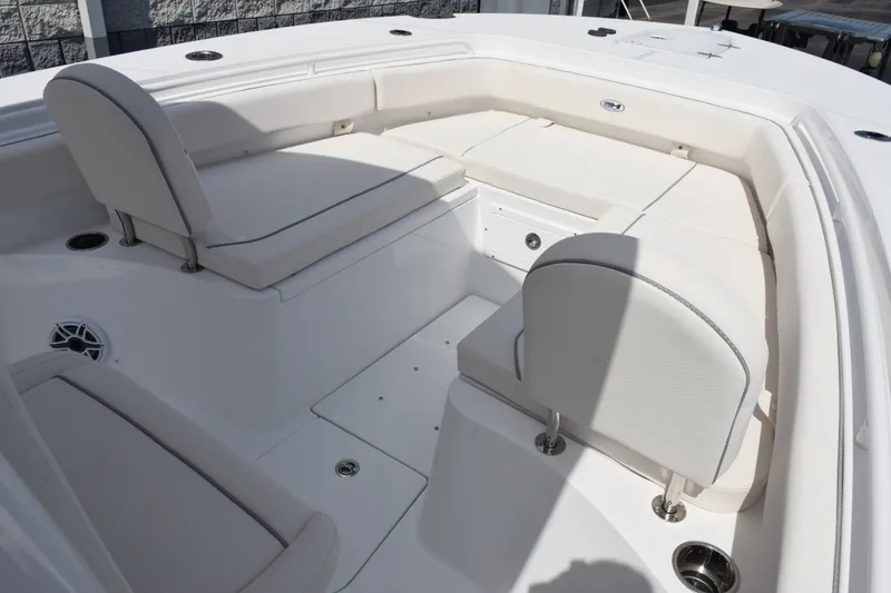 Slide: The Image of 2026 Sea Hunt Gamefish 27 Forward Seating, spacious white interior with comfortable seating. - 13