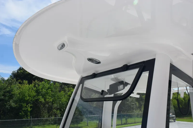 Slide: The Image of 2026 Sea Hunt Gamefish 27 Forward Seating boat with sleek T-top design. - 20