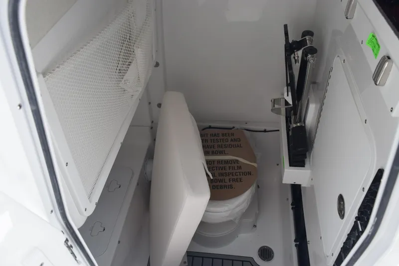 Slide: The Image of Interior of 2026 Sea Hunt Gamefish 27 boat, featuring compact storage and seating area. - 21