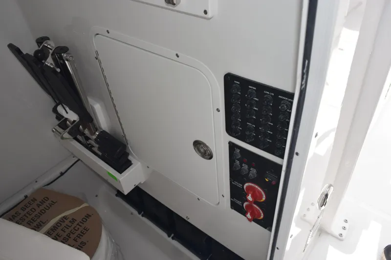 Slide: The Image of 2026 Sea Hunt Gamefish 27 Forward Seating boat control panel and storage area. - 23