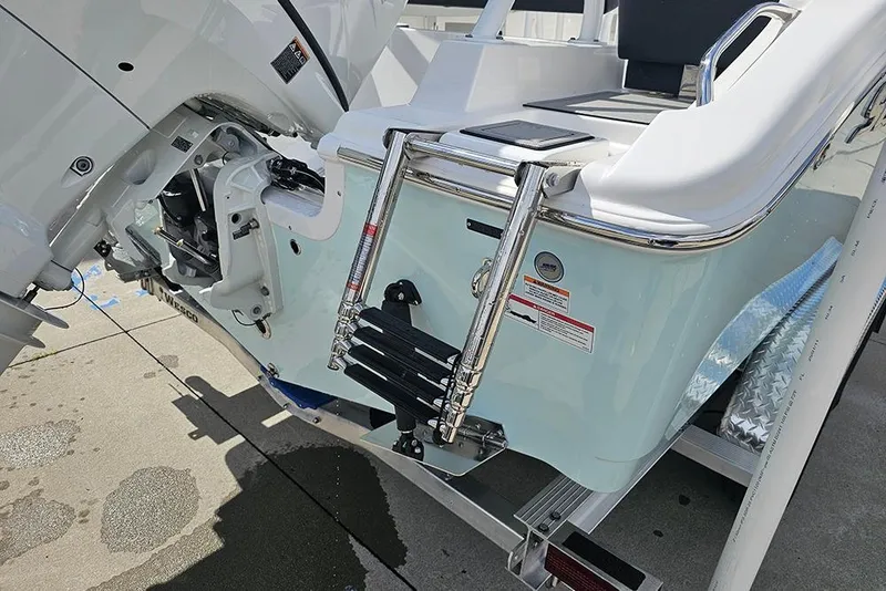 Slide: The Image of 2026 Sea Pro 225 Sandbar boat with ladder and motor detail. - 12