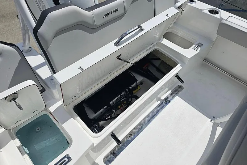 Slide: The Image of 2026 Sea Pro 225 Sandbar boat interior with open storage compartments. - 15