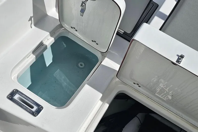 Slide: The Image of Open storage compartments on a 2026 Sea Pro 225 Sandbar boat. - 16