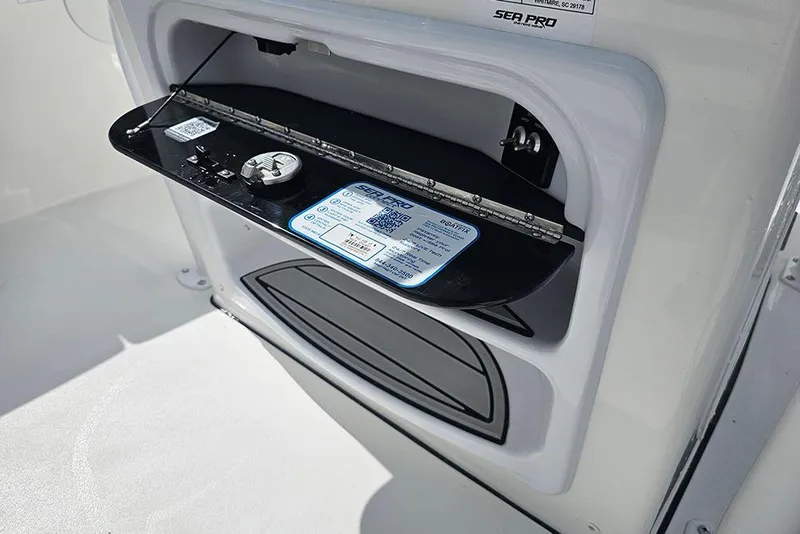 Slide: The Image of 2026 Sea Pro 225 Sandbar boat compartment with open hatch and visible QR code. - 19