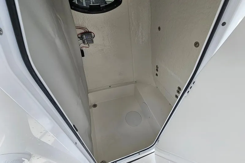 Slide: The Image of 2026 Sea Pro 225 Sandbar boat interior compartment, white and spacious design. - 23