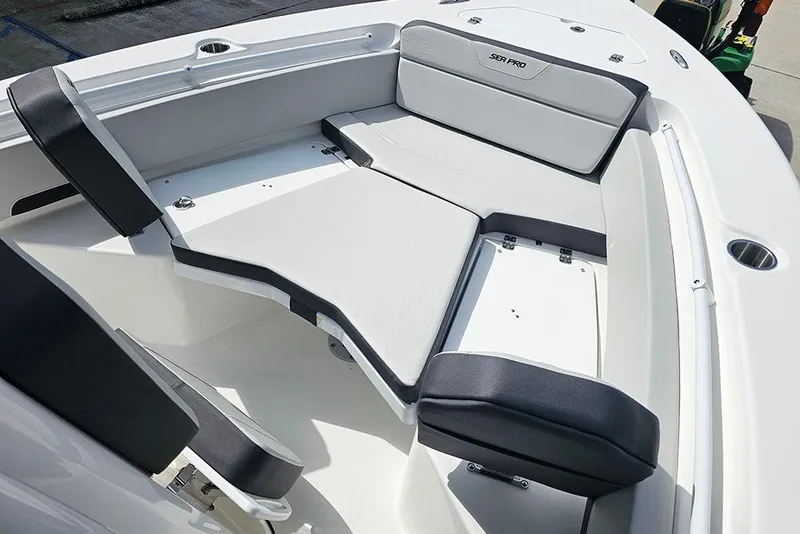 Slide: The Image of 2026 Sea Pro 225 Sandbar boat interior with cushioned seating and sleek design. - 26