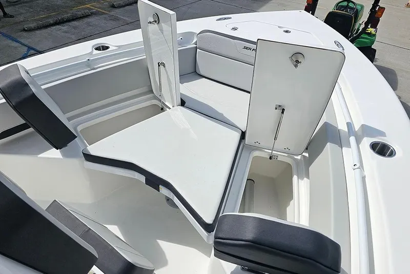 Slide: The Image of 2026 Sea Pro 225 Sandbar boat interior with open storage compartments and seating. - 27