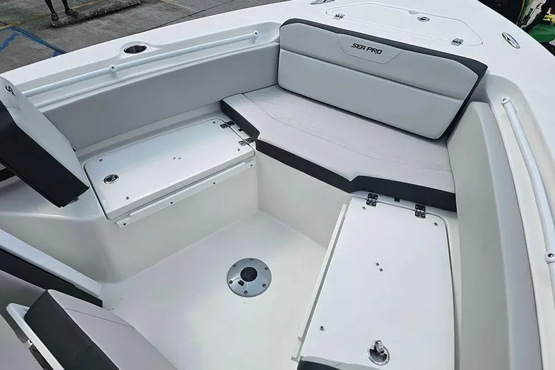 Slide: The Image of 2026 Sea Pro 225 Sandbar boat interior with seating and storage compartments. - 28