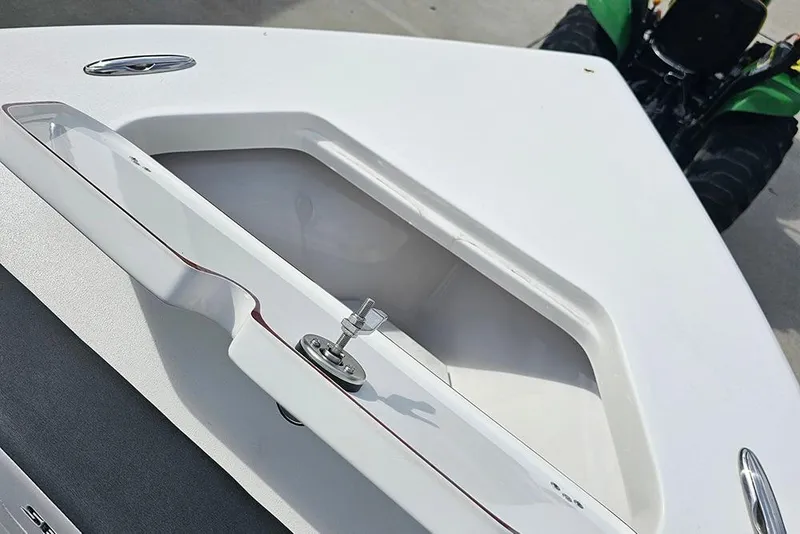 Slide: The Image of 2026 Sea Pro 225 Sandbar boat detail with storage compartment and latch. - 29